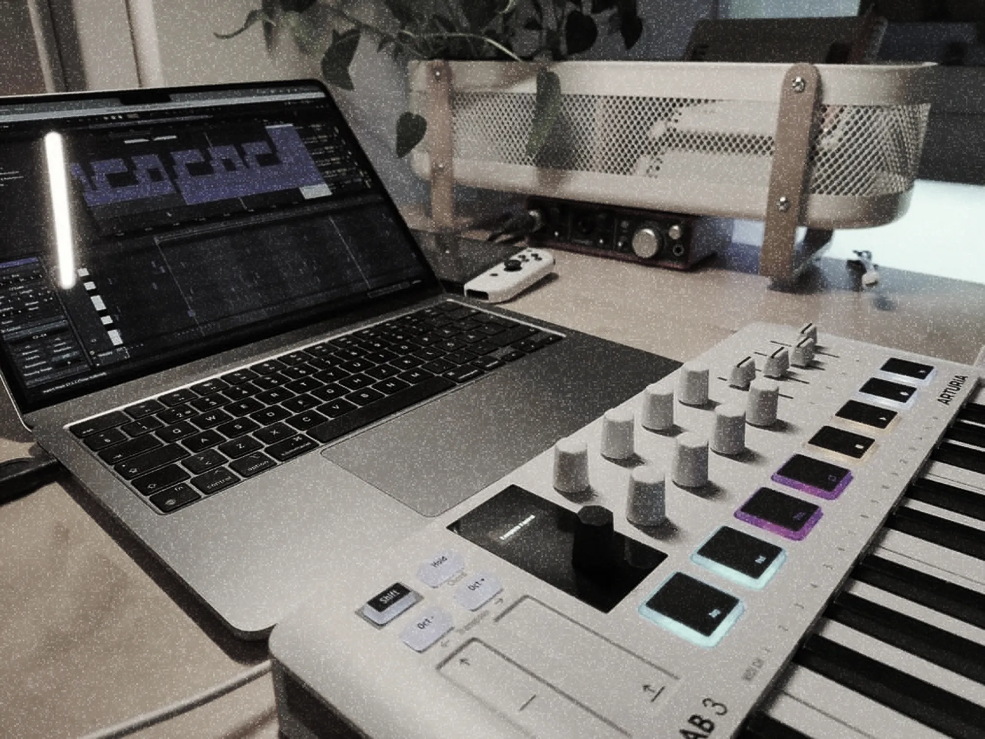 MIDI keyboard, microphone, and laptop